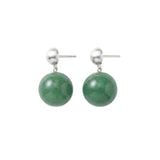 Pair of green spherical jade earrings with silver posts on a white background