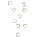 Nine white jade ear cuffs photographed on white background