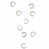 Nine white jade ear cuffs photographed on white background