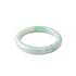 A slightly angled top-down shot of a light green and white jade bangle bracelet with a smooth, polished finish, shown on a plain white background.