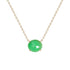 A delicate gold chain necklace featuring a small, oval-cut green gemstone pendant in a four-prong setting, shown against a plain white background.