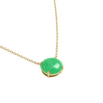A gold chain necklace featuring a round, polished green stone pendant in a gold bezel setting, shown against a plain white background.