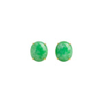 A pair of green oval gemstone stud earrings against a white background