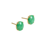 Pair of gold stud earrings with green jade on a white background