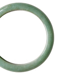 A close-up shot of a single light green jade bangle bracelet shown on a plain white background.