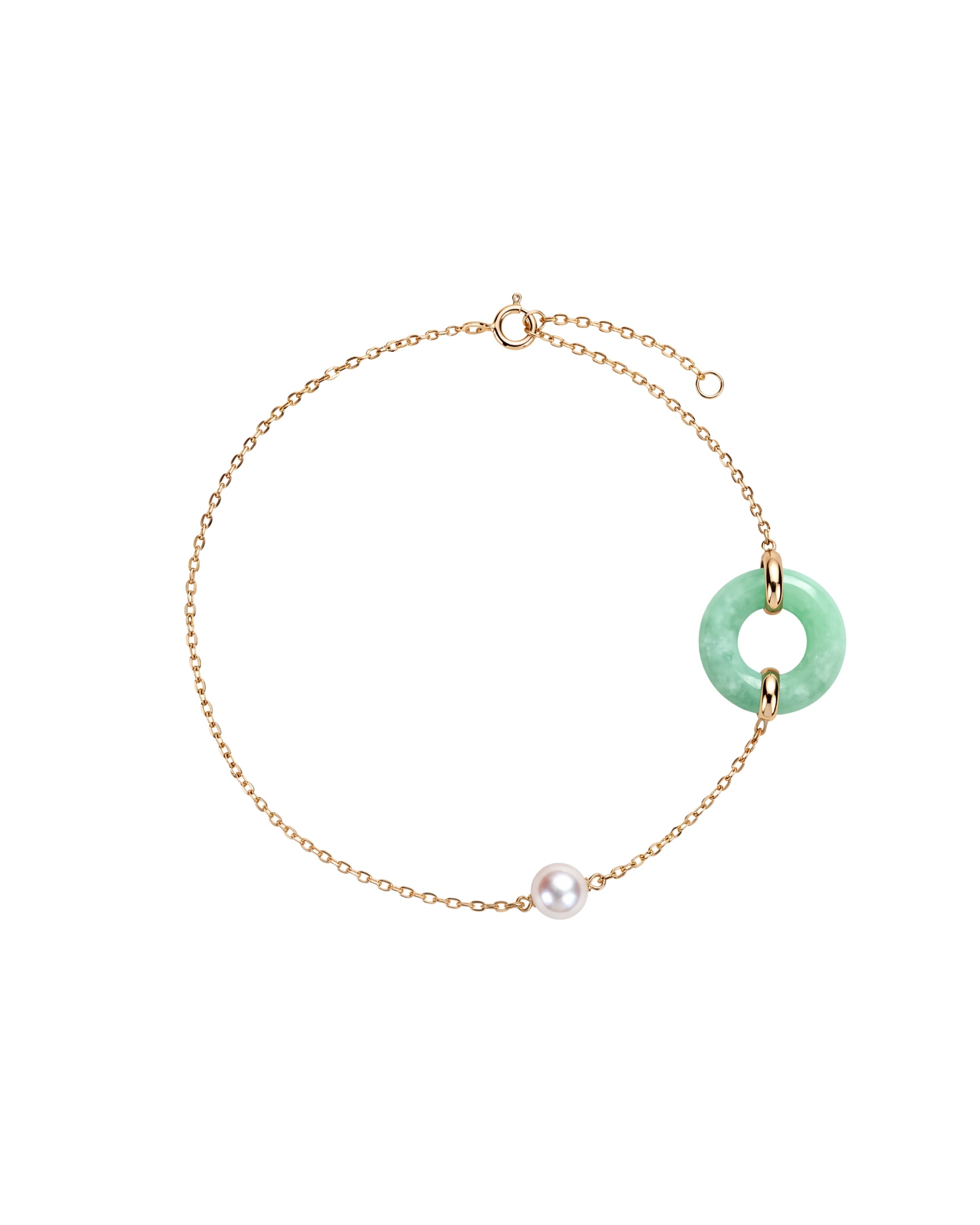 A delicate gold chain bracelet featuring a light green jadeite ring pendant and a single white pearl bead, displayed on a clean white background.