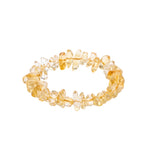 Yellow beaded bracelet on a white background shot from 45 degree angle