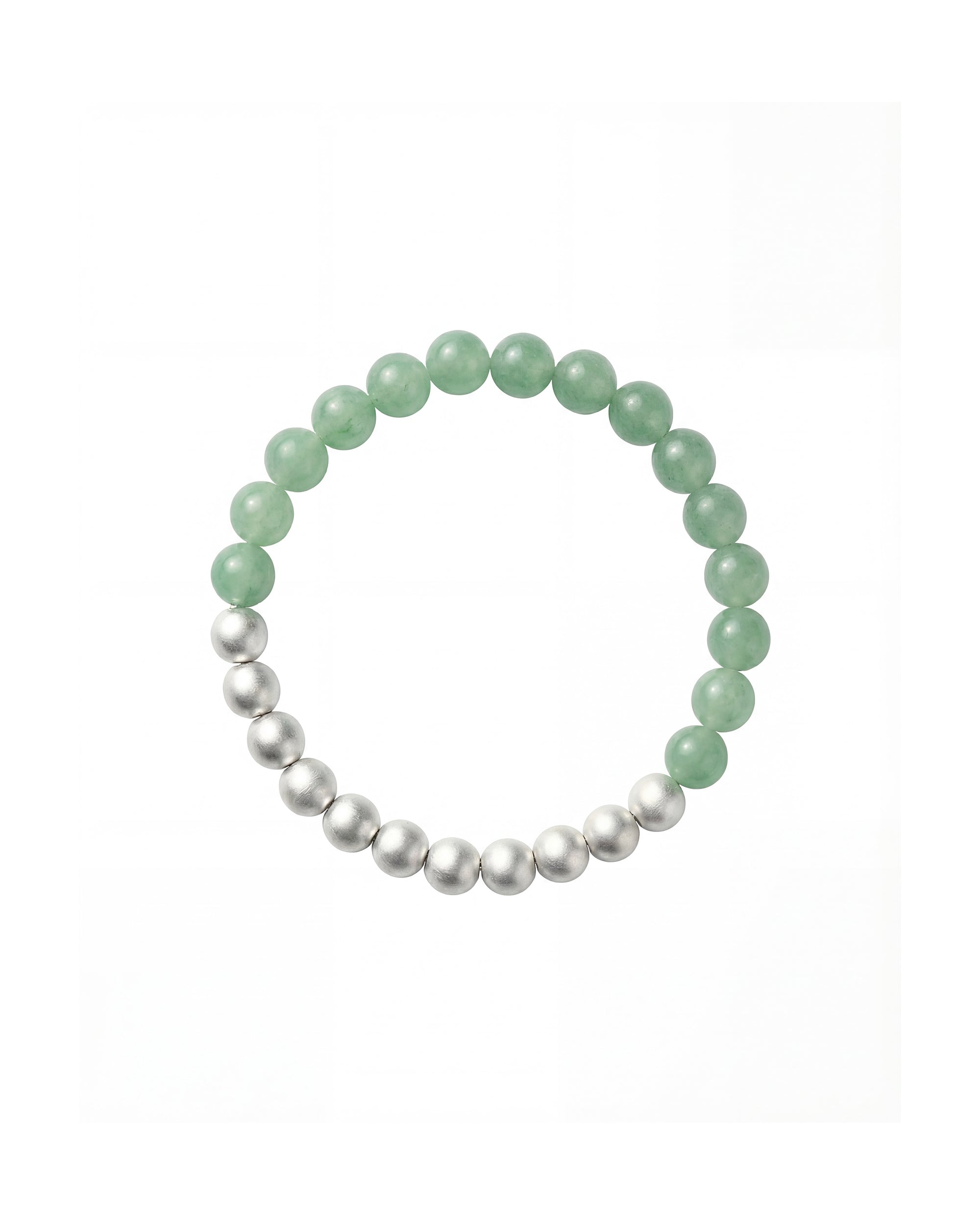 Flatlay shot of a green and silver beaded bracelet showcasing a half-and-half arrangement of polished round beads.