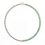 Green and silver beaded necklace showcasing a half-and-half arrangement of polished round beads with a silver clasp, shot on white background.