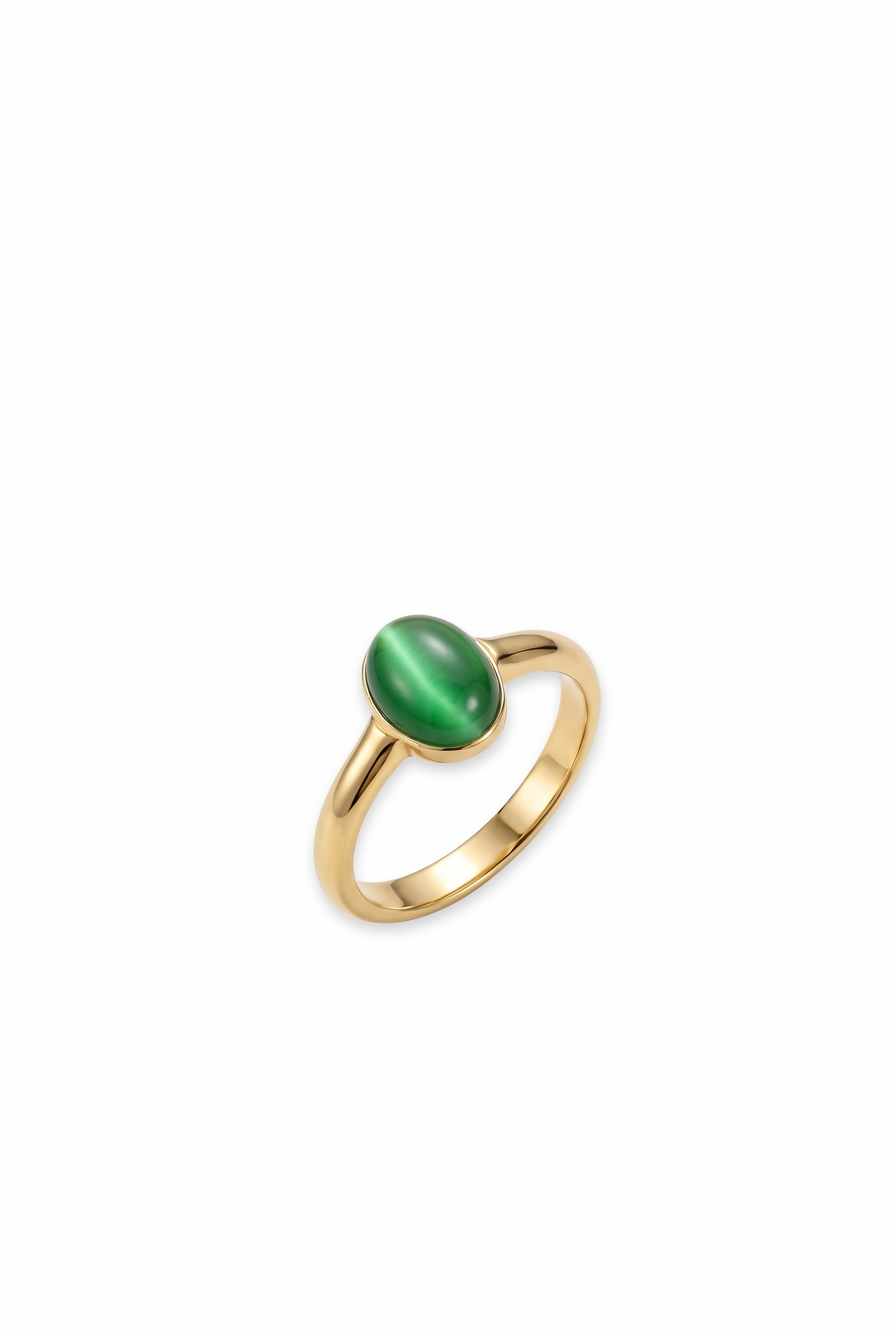 Angled shot of a gold ring with a green stone on a white background
