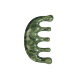 Green stone tool with a curved design on a white background