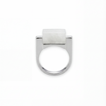 Silver ring with a white hanbai jade stone on a white background