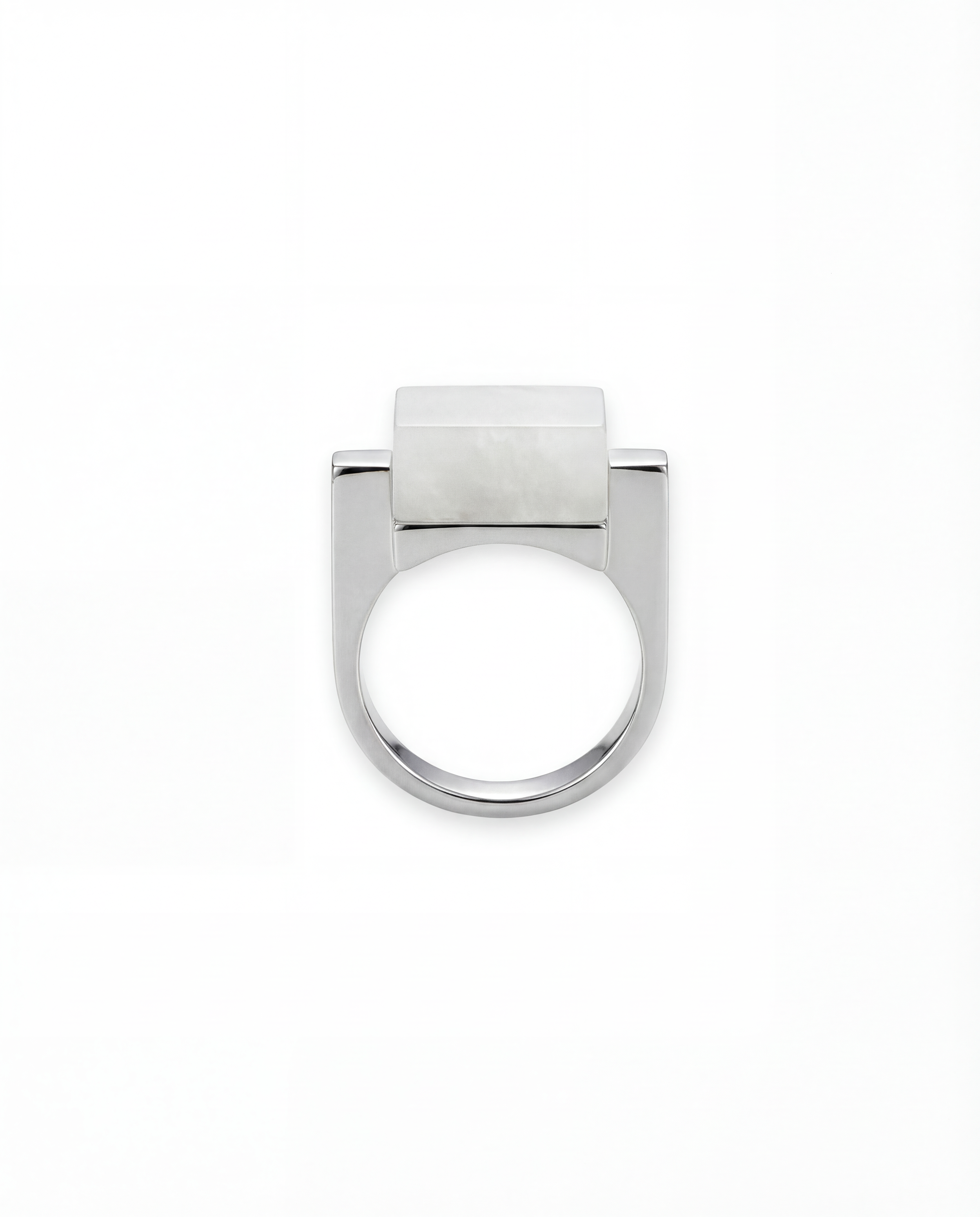 Silver ring with a white hanbai jade stone on a white background