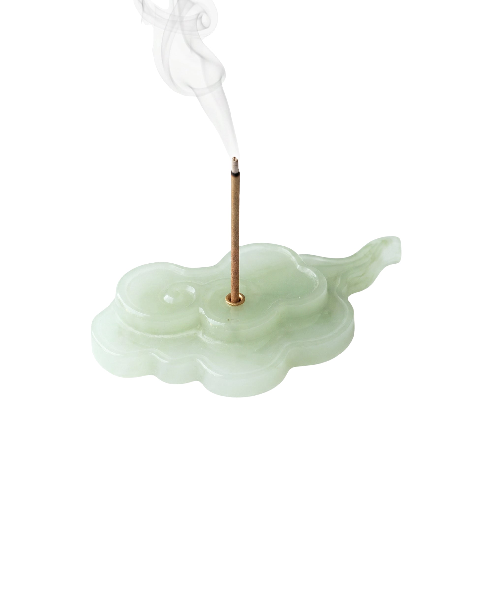 Incense holder shaped like a cloud with a smoking incense stick on a white background