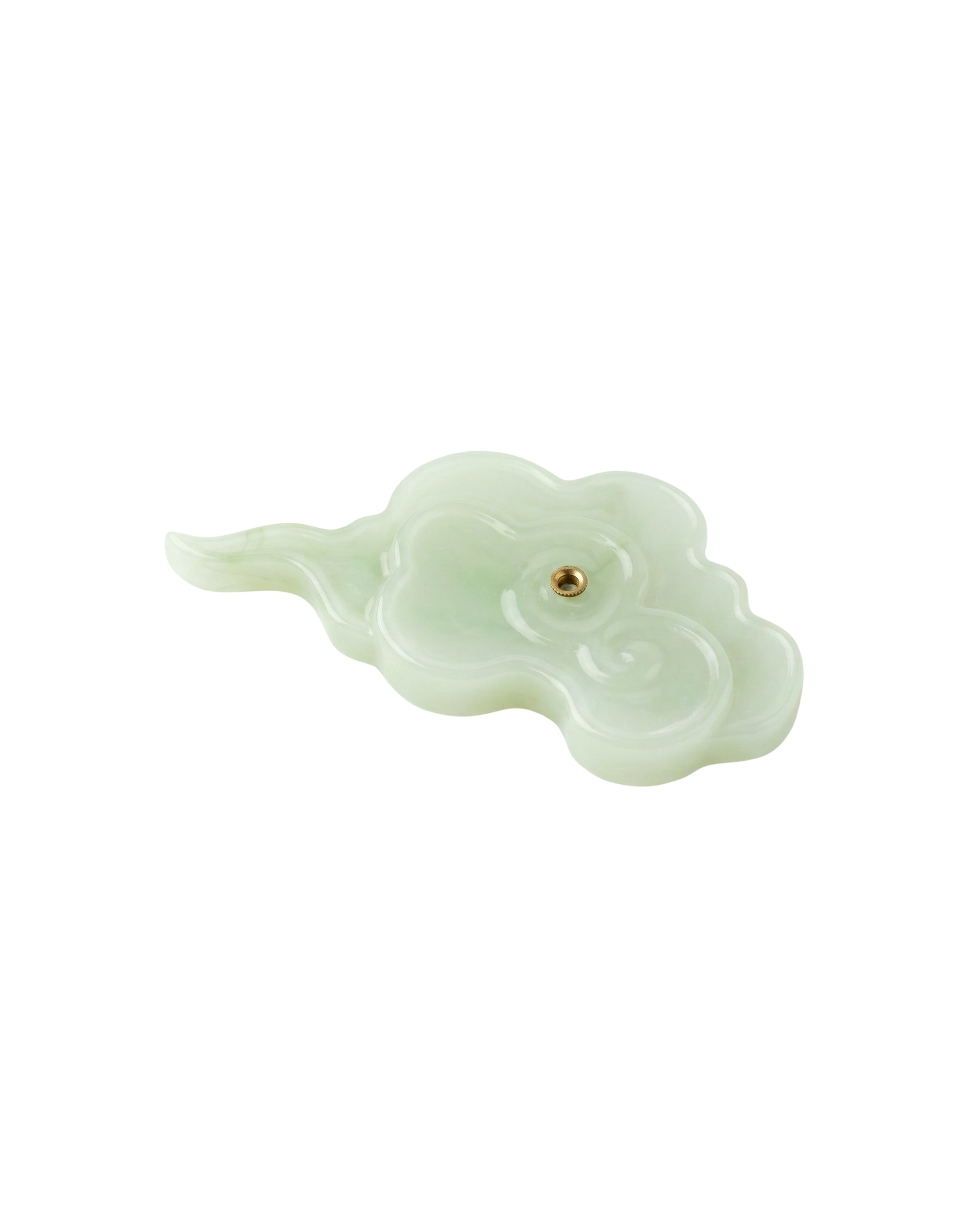 Incense holder shaped like a cloud on a white background, close-up