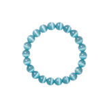 Flatlay shot of a blue cat's eye beaded bracelet on a white background