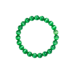 Flatlay shot of a green cat's eye beaded bracelet on a white background