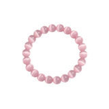 Flatlay shot of a pink cat's eye beaded bracelet on a white background