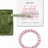 Pink beaded bracelet with 'seree' packaging on a white background