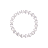 Flatlay shot of a white cat's eye beaded bracelet on a white background