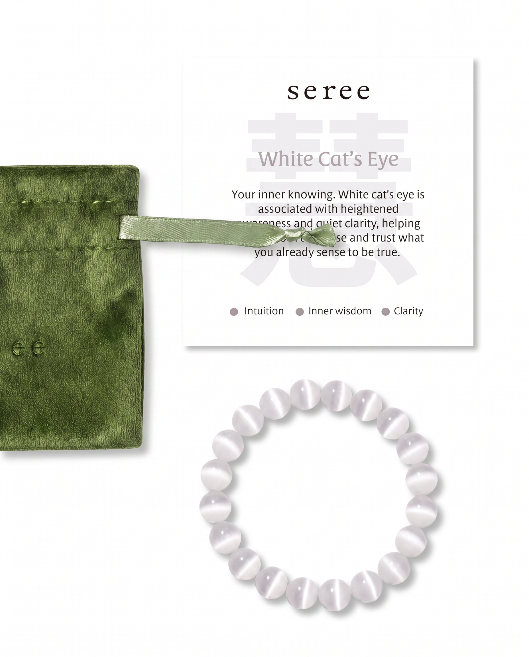 White cat's eye beaded bracelet with green jewelry bag and information card on a white background