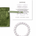 White cat's eye beaded bracelet with green jewelry bag and information card on a white background