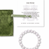 White cat's eye beaded bracelet with green jewelry bag and information card on a white background