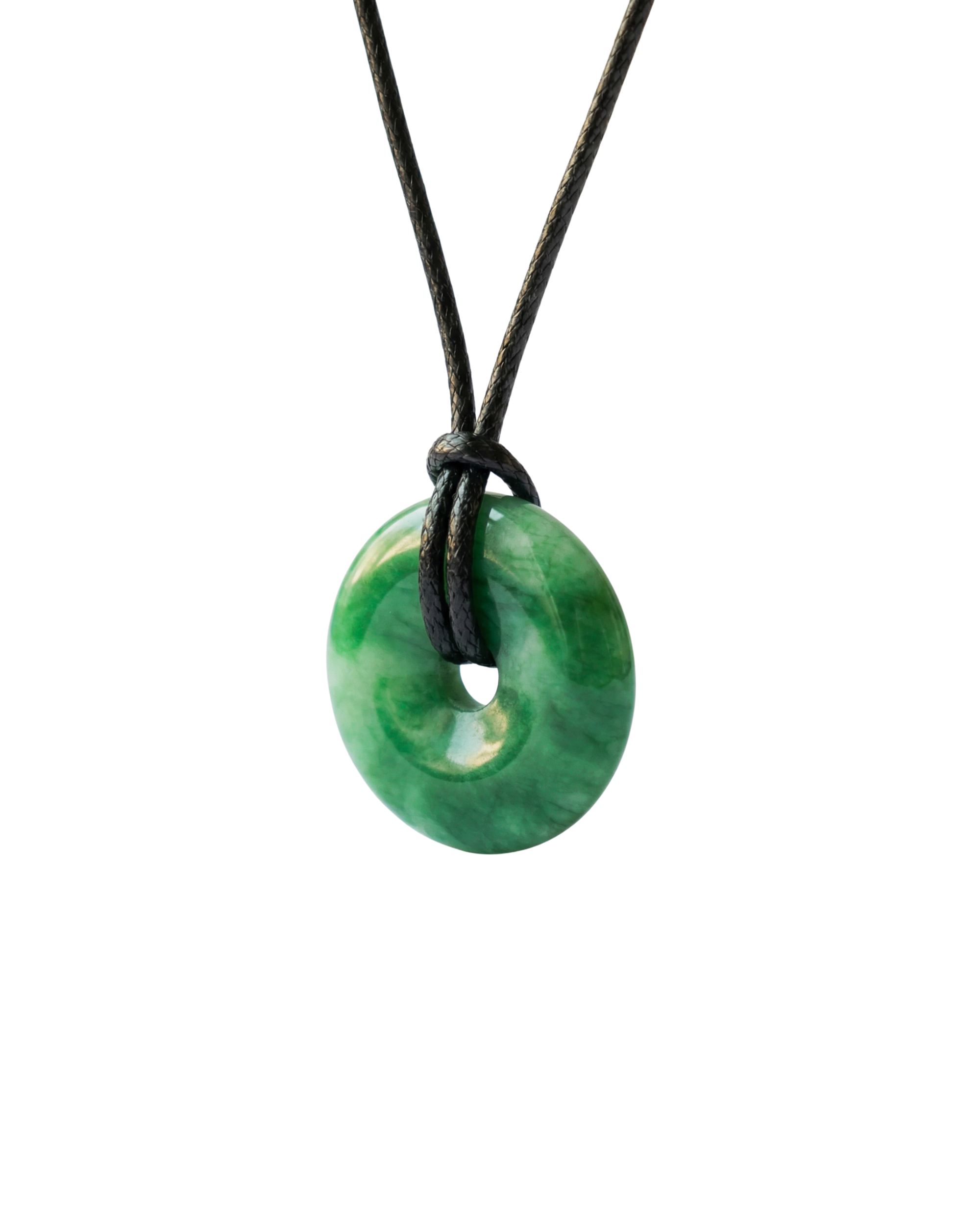 Green donut-shaped pendant on a black cord against a white background