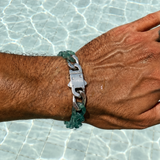 Hand wearing a bracelet with a clear background