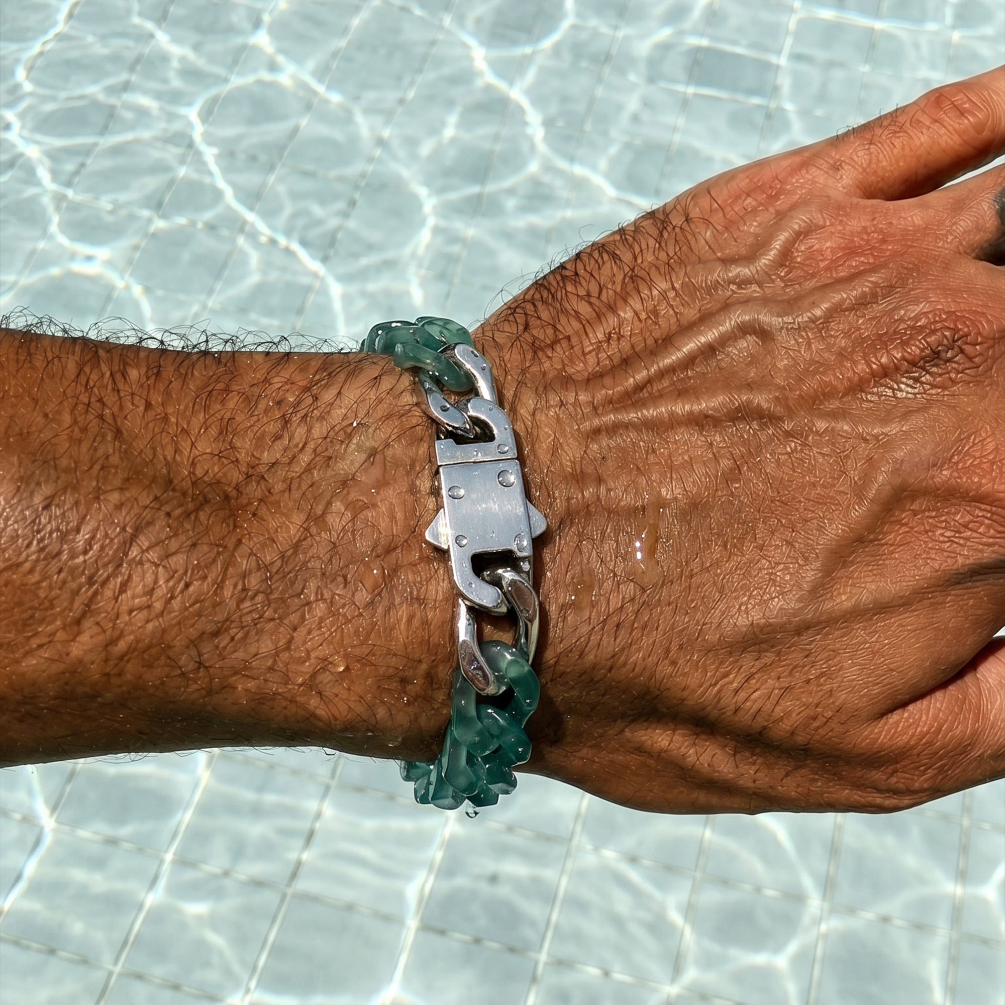 Hand wearing a bracelet with a clear background