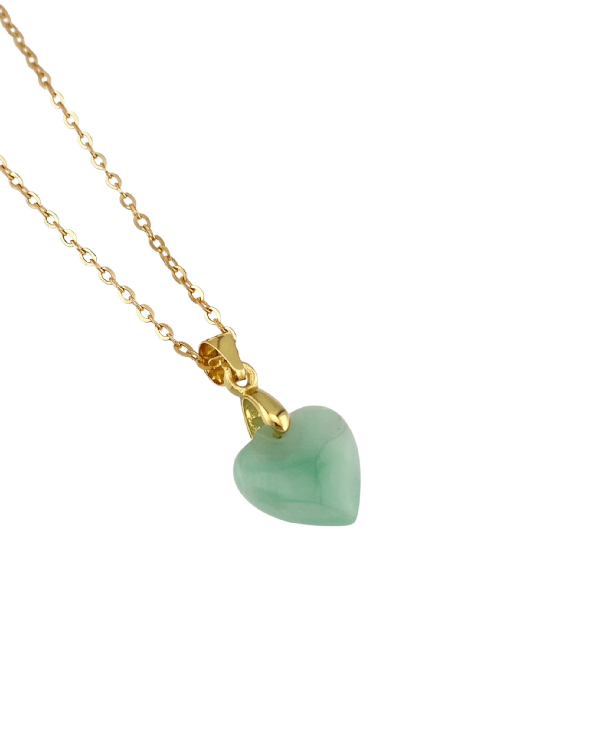 Close-up shot of a necklace with a green heart-shaped pendant on a gold-plated chain against a white background