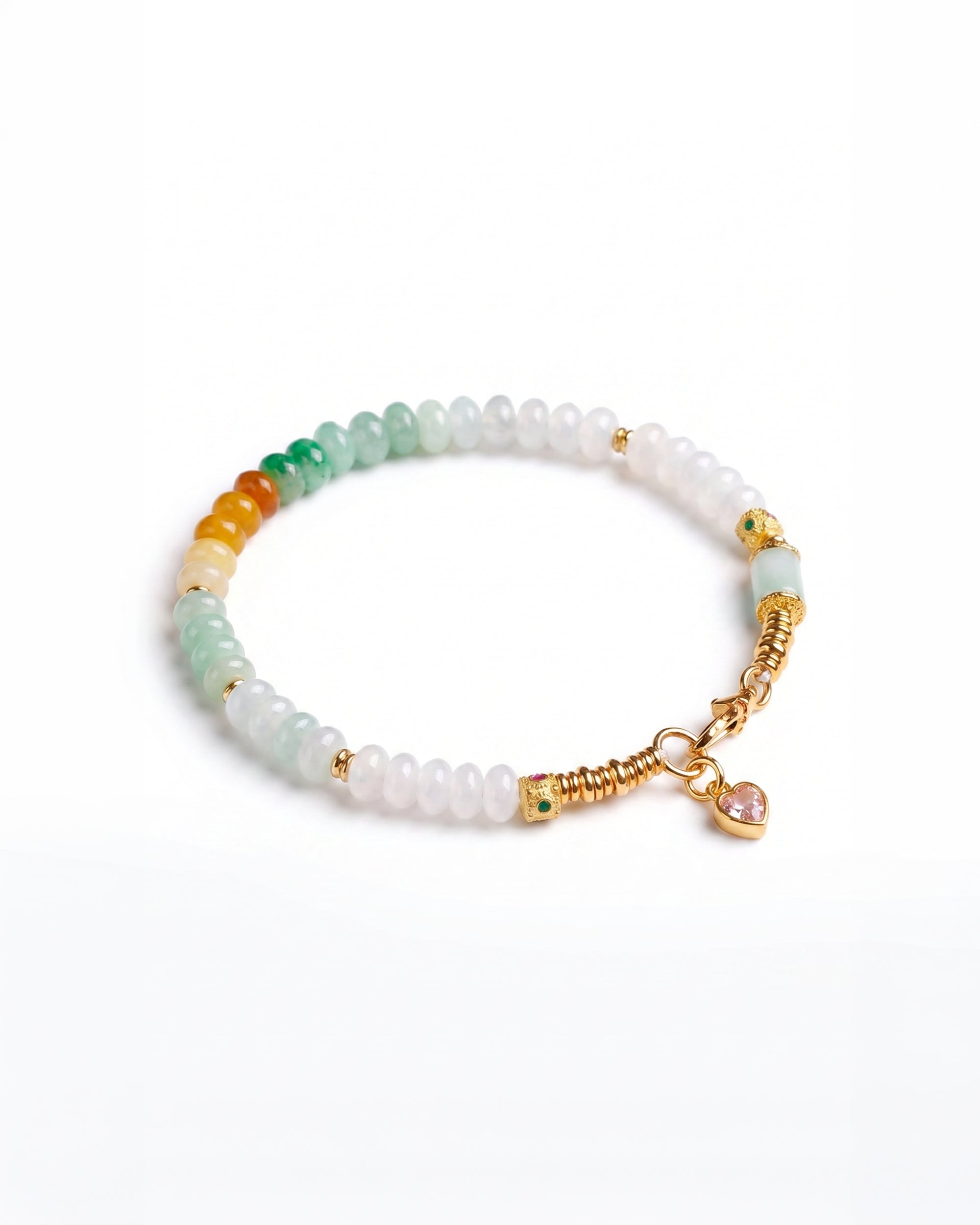 Beaded bracelet with gold accents and a heart charm on a white background