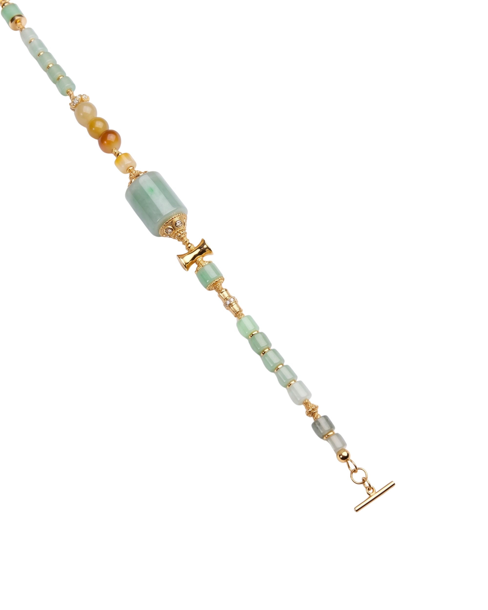 Close-up of green beaded bracelet with gold accents on a white background