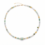 Necklace with multicolored jade beads and a jade barrel pendant on a white background, top view