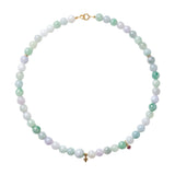 Jade bead necklace with mixed green and off-white jade stones, top view