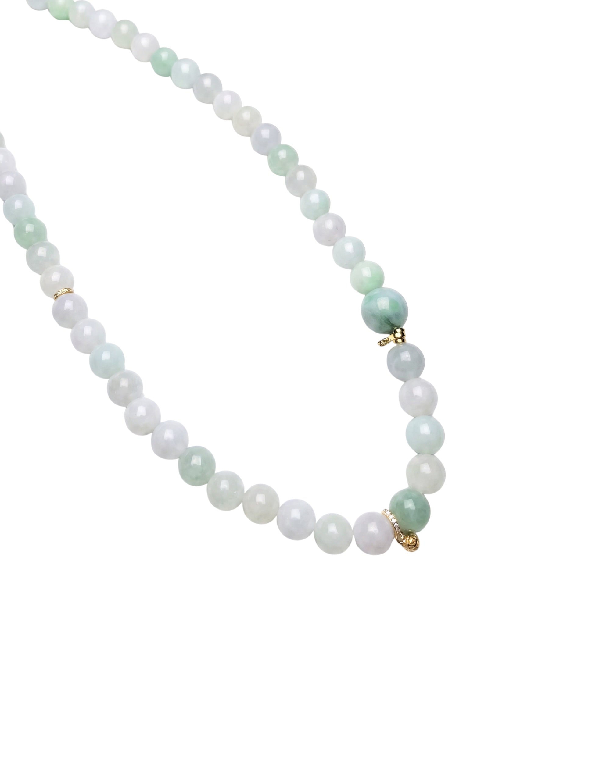 Jade bead necklace with mixed green and off-white jade stones, close-up