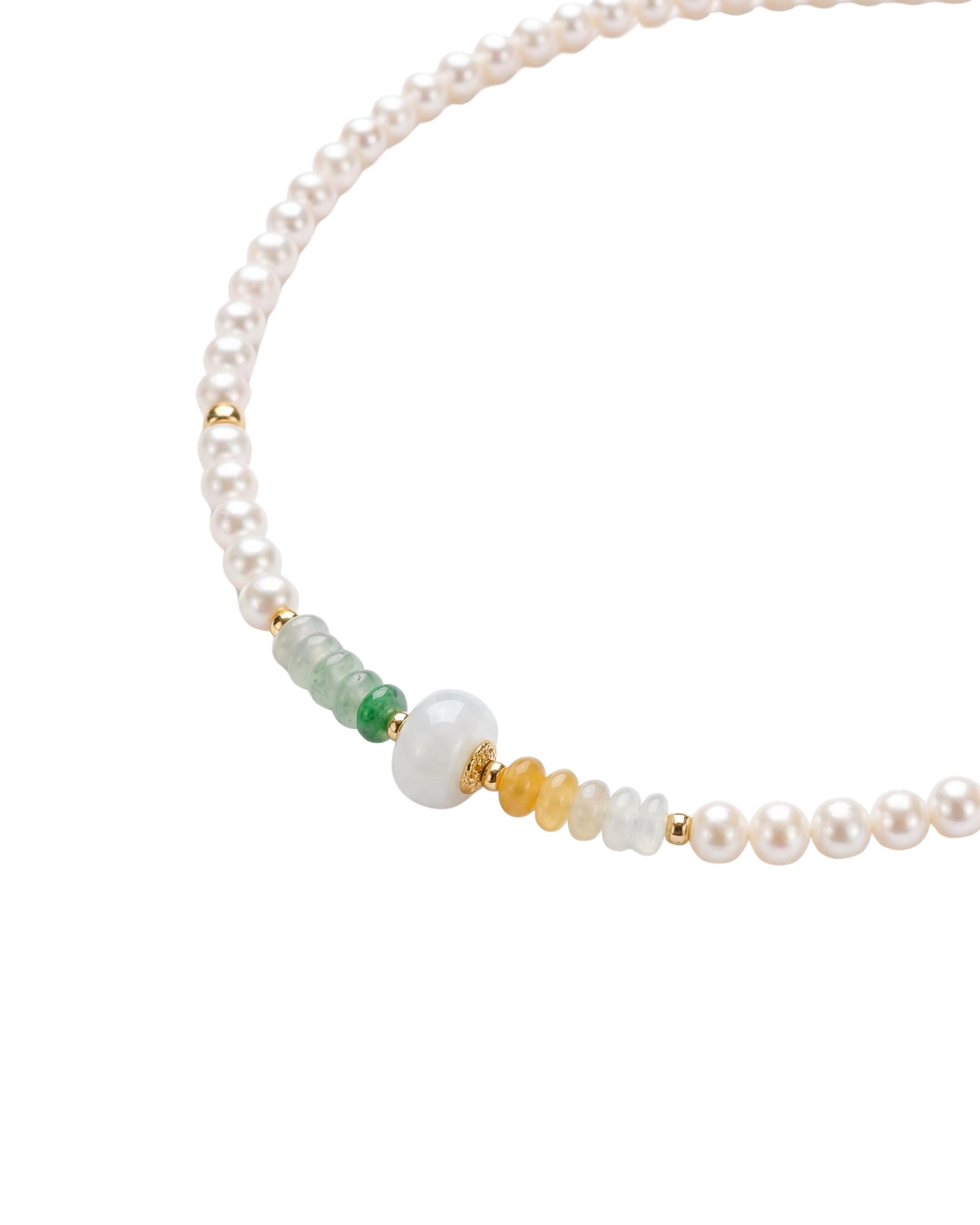 Pearl beaded necklace with green and gold jade beads on a white background, close-up