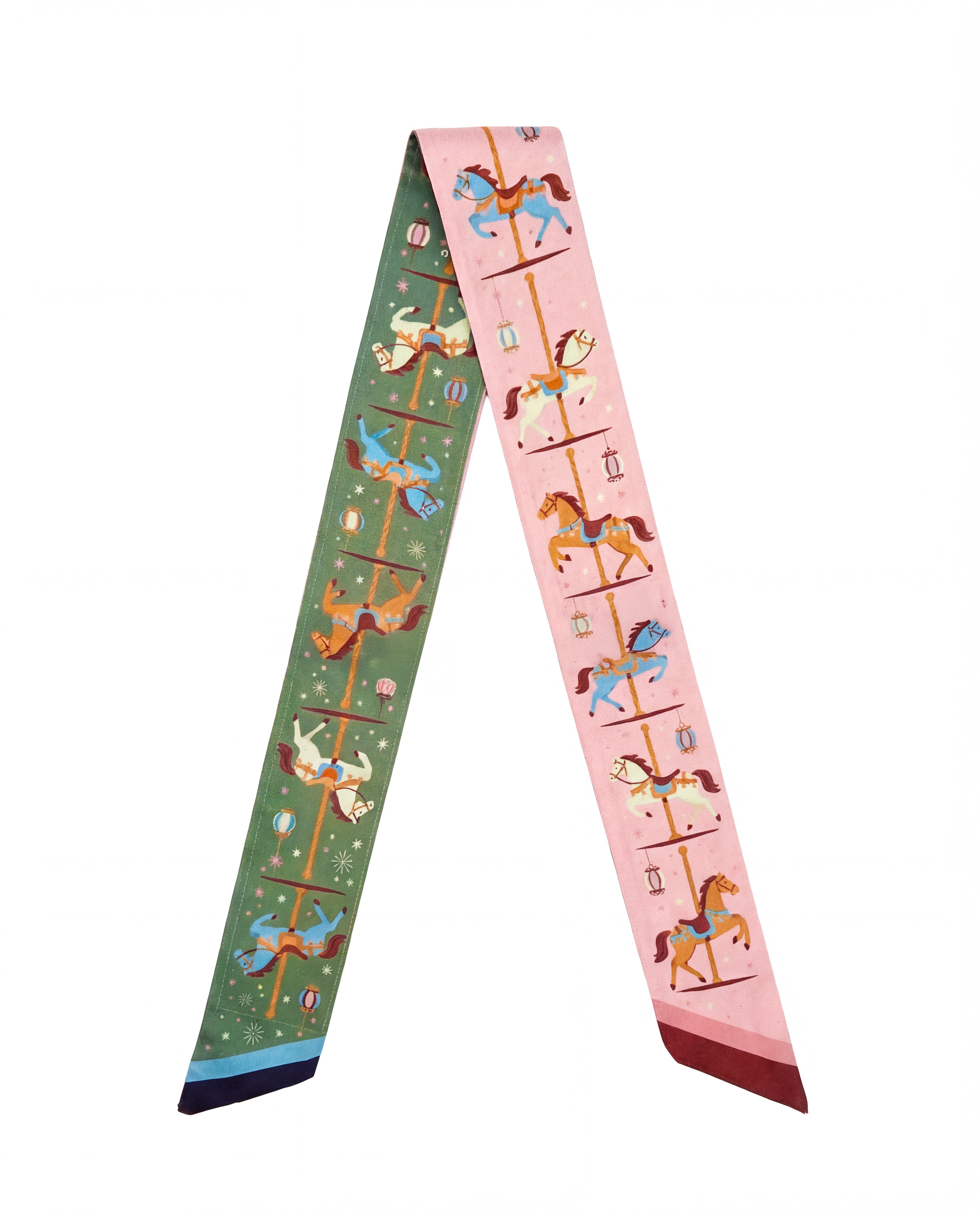 A green and pink scarf with carousel designs on a white background